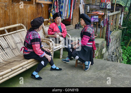Yao women chatting, Dazhai village, Guangxi Autonomous Region, China Stock Photo