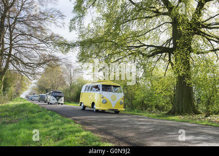 Volkswagen Split Screen camper vans in convoy on a english country road. Leicestershire, England Stock Photo