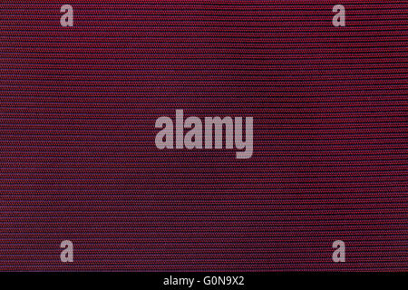 Close up of the weave of red satin material Stock Photo