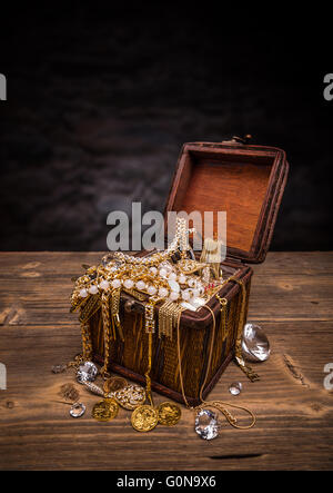 Open treasure chest full of jewellery Stock Photo