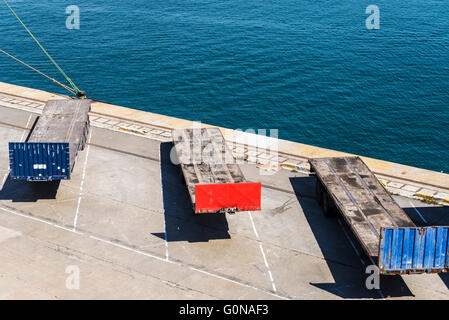 Empty containers parked in a row waiting to board at the port of Barcelona, Catalonia, Spain Stock Photo