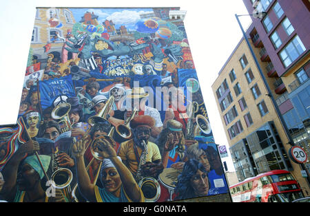 Gentrification in Dalston, East London - Hackney Peace Mural dates from 1980s Stock Photo