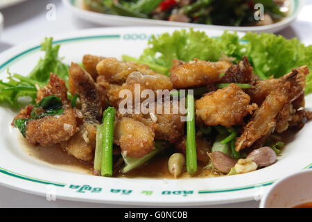 Chinese cuisine: Stir fried fish fillets with green vegetables in a white garlic Stock Photo