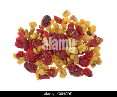 Top view of a portion of cranberries and walnuts isolated on a white background. Stock Photo