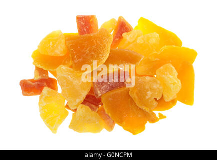 Top view of a serving of pineapple, mango and papaya sugared dried fruit isolated on a white background. Stock Photo