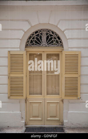 An old weathered french window with opened shutters Stock Photo - Alamy