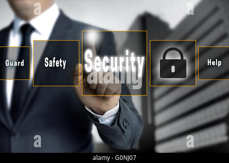 Security touchscreen is operated by businessman. Stock Photo