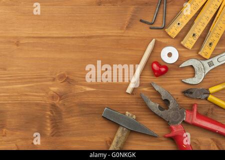 Set of tools and instruments on wooden background. Different kinds of tools for household chores. Home repairs. Father's Day. Stock Photo