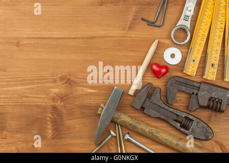 Set of tools and instruments on wooden background. Different kinds of tools for household chores. Home repairs. Father's Day. Stock Photo