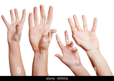 Many hands reaching out in the air for help Stock Photo