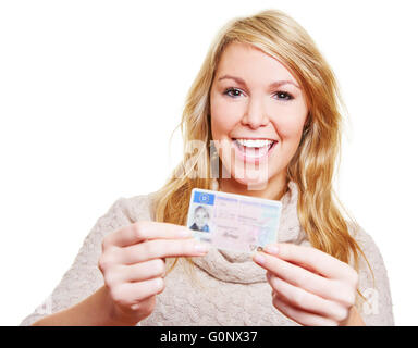 Happy young woman showing proudly her new driving licence Stock Photo