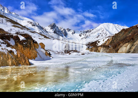 Trail on frozen river in mountains of Eastern Sayan . On this path moving climbers for climbing to tops of mountains . Buryatia Stock Photo