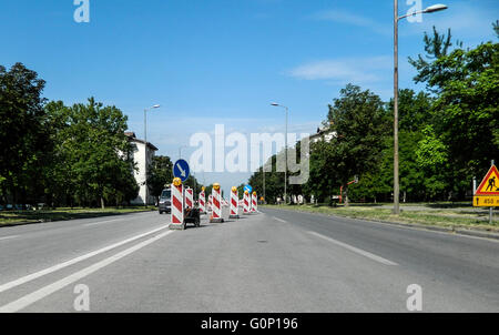 Traffic signs on the roadway in a city street. Stock Photo