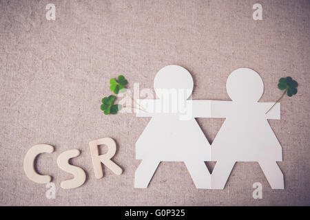 CSR concept, people paper holding each other,toning Stock Photo