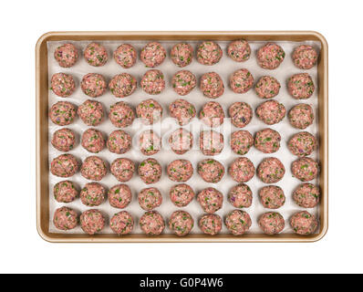 Cooking tray with rows of prepared homemade meatballs, overhead view isolated on white background Stock Photo