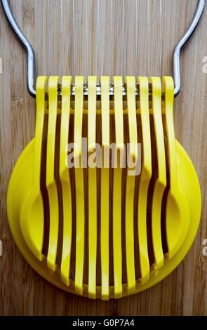 A Yellow Plastic Egg Slicer Stock Photo