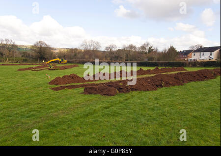 Archaeological investigation in progress on a green field site at Hay-on-Wye where Persimmon Homes have applied for planning permission to build 80 new houses. The site is within the Brecon Beacons National Park. Stock Photo
