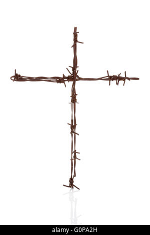 Religious war. Rusty barbwire cross isolated over white. Stock Photo
