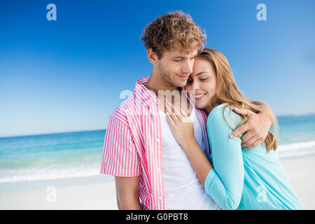 Happy couple hugging on the beach Stock Photo