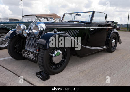 A Black, 1947,  Morgan 4-4 Drophead Coupé, on static display at the Silverstone Classic Media Day 2016. Stock Photo