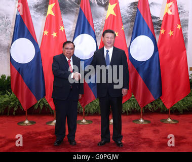 Beijing, China. 3rd May, 2016. Chinese President Xi Jinping (R) holds talks with Lao President Bounnhang Vorachit in Beijing, capital of China, May 3, 2016. Credit:  Pang Xinglei/Xinhua/Alamy Live News Stock Photo