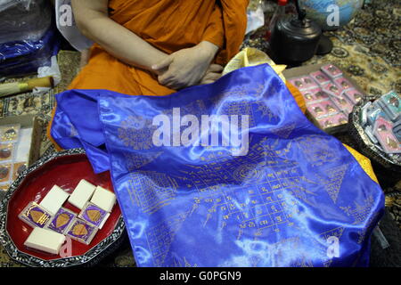 Bangkok, Thailand. 3rd May, 2016. Thai Buddhist monk Phra Prommangkalachan displays a sacred holy unbeatable Leicester City fabric and talisman to members of the media at Wat Traimit temple in Bangkok. The Thai Buddhist monk became famous and well known as a magic monk as he is credited to be a part of Leicester City's success after he traveled several times to King Power Stadium in England. Credit:  Piti A Sahakorn/Alamy Live News Stock Photo