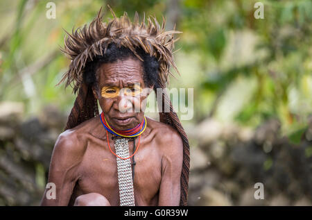 Dani tribe woman in a village of Ugem in West Papua, Indonesia Stock Photo
