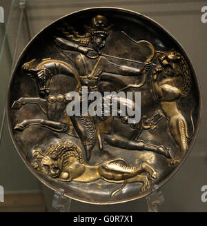 Sasanian Empire. King Shapur II (Reigh 309-379). Plate with Shapur II on a Lion Hunt. Silver; chasing, gilding. Iran. 4th century. Found as a part a treasure in Vyatka Region. The State Hermitage Museum. Saint Petersburg. Russia. Stock Photo