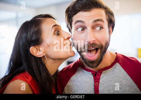Woman giving a kiss on the cheek Stock Photo