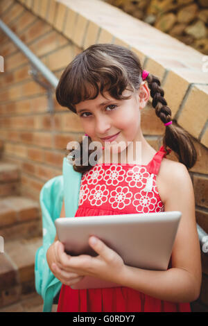 Schoolgirl with a digital tablet Stock Photo