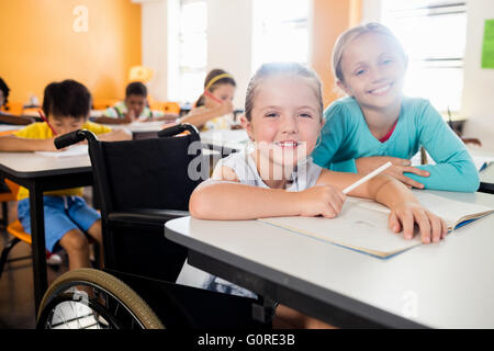 Two Female Elementary School Pupils Reading In Library Stock Photo - Alamy