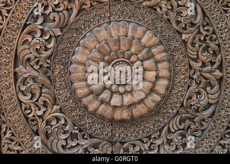 Pattern of flower carved on wood background Stock Photo