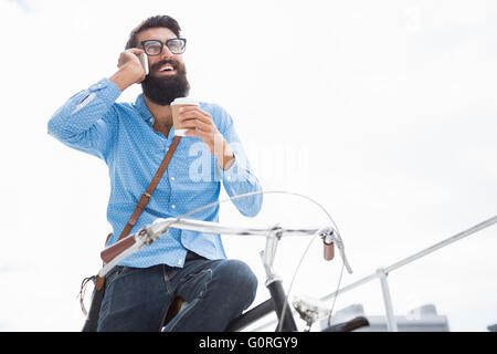 Hipster calling someone Stock Photo