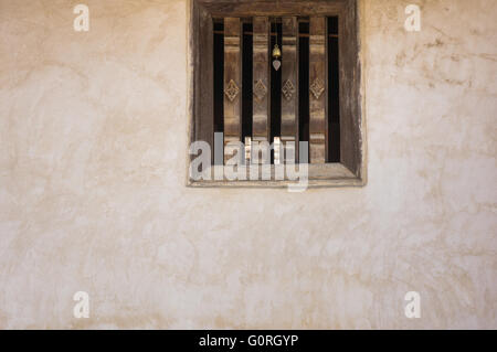 old dirty window on old dirty wall Stock Photo