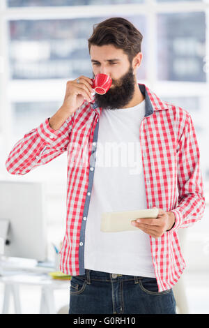 Hipster man is drinking a coffee Stock Photo