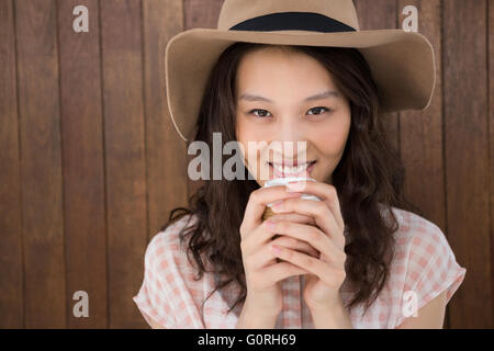 Hipster woman drinking a coffee Stock Photo