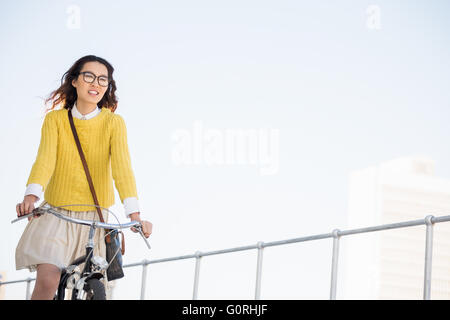 Hipster riding a bike Stock Photo