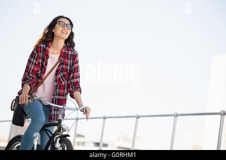 Hipster riding a bike Stock Photo
