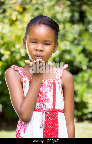 Portrait of cute girl blowing a kiss to the camera Stock Photo