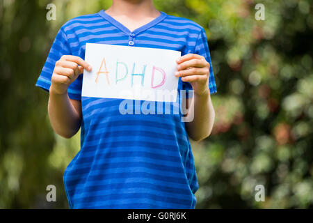 Portrait of young boy holding a message Stock Photo