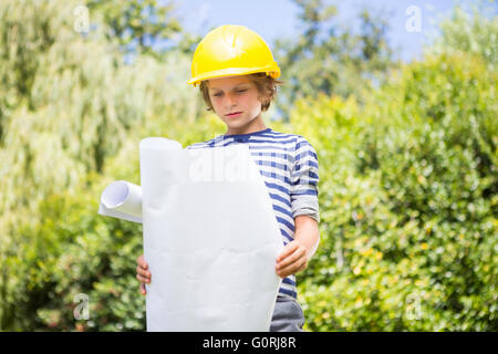 Cute boy pretending to be a worker Stock Photo