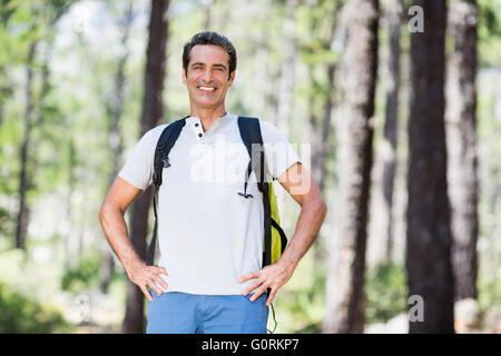Man smiling and posing with his hands on hips Stock Photo