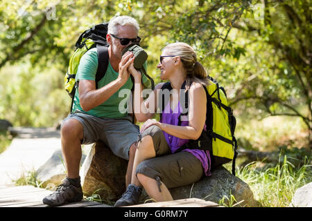 Couple taking a break during a hike Stock Photo
