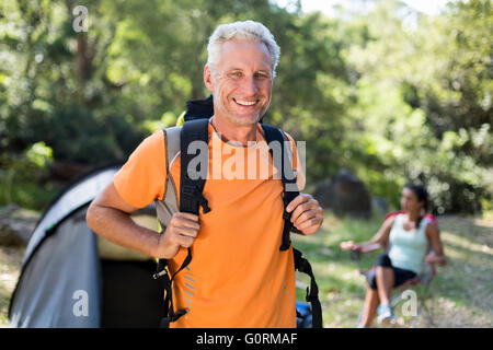 Man smiling and posing with his backpack Stock Photo