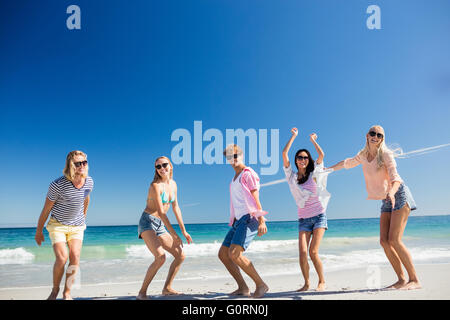 Portrait of friends posing at the beach Stock Photo