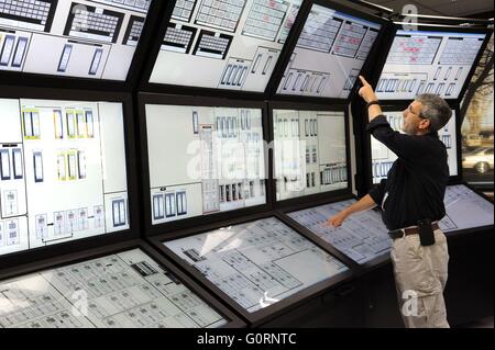 A scientist in the Human Systems Simulation Laboratory, a complete virtual nuclear control room created to safely test new technologies before they are implemented in real commercial reactors at the Idaho National Laboratory in Idaho Falls, Idaho. Stock Photo