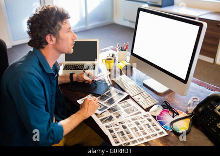 Photographer working on his computer Stock Photo
