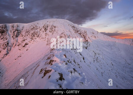 Helvellyn & Striding Edge in winter at sunrise, English Lake District Stock Photo