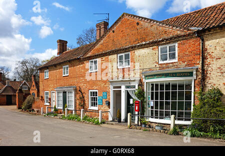 A small row of shops and cottages in the village of Heydon, Norfolk, England, United Kingdom. Stock Photo