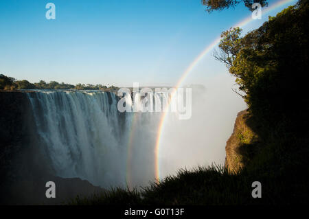 Victoria Falls and afternoon rainbow, Zimbabwe Stock Photo